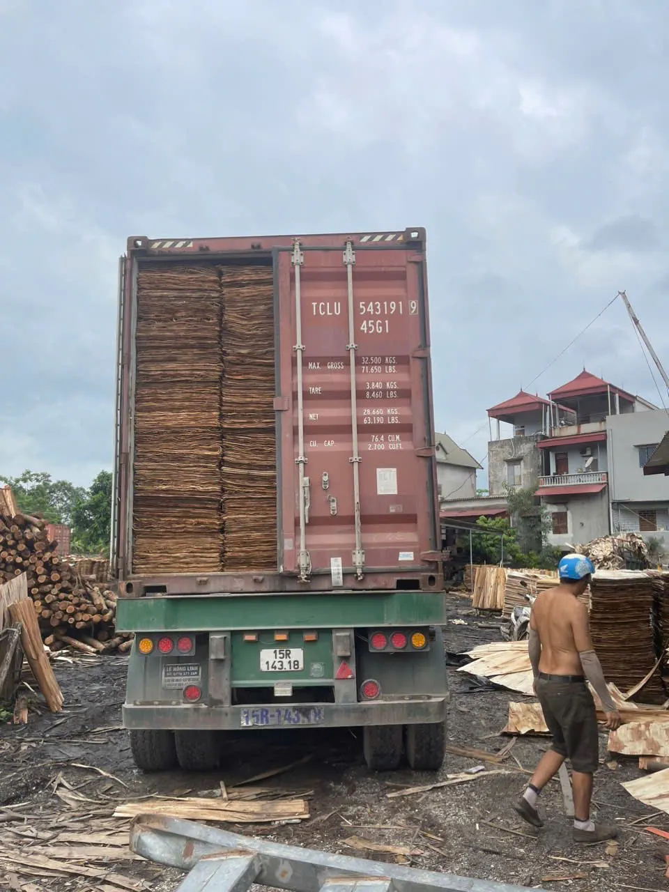 Vietnam vs Indonesia plywood export comparison — stacked plywood panels ready for container loading at HCPLY factory