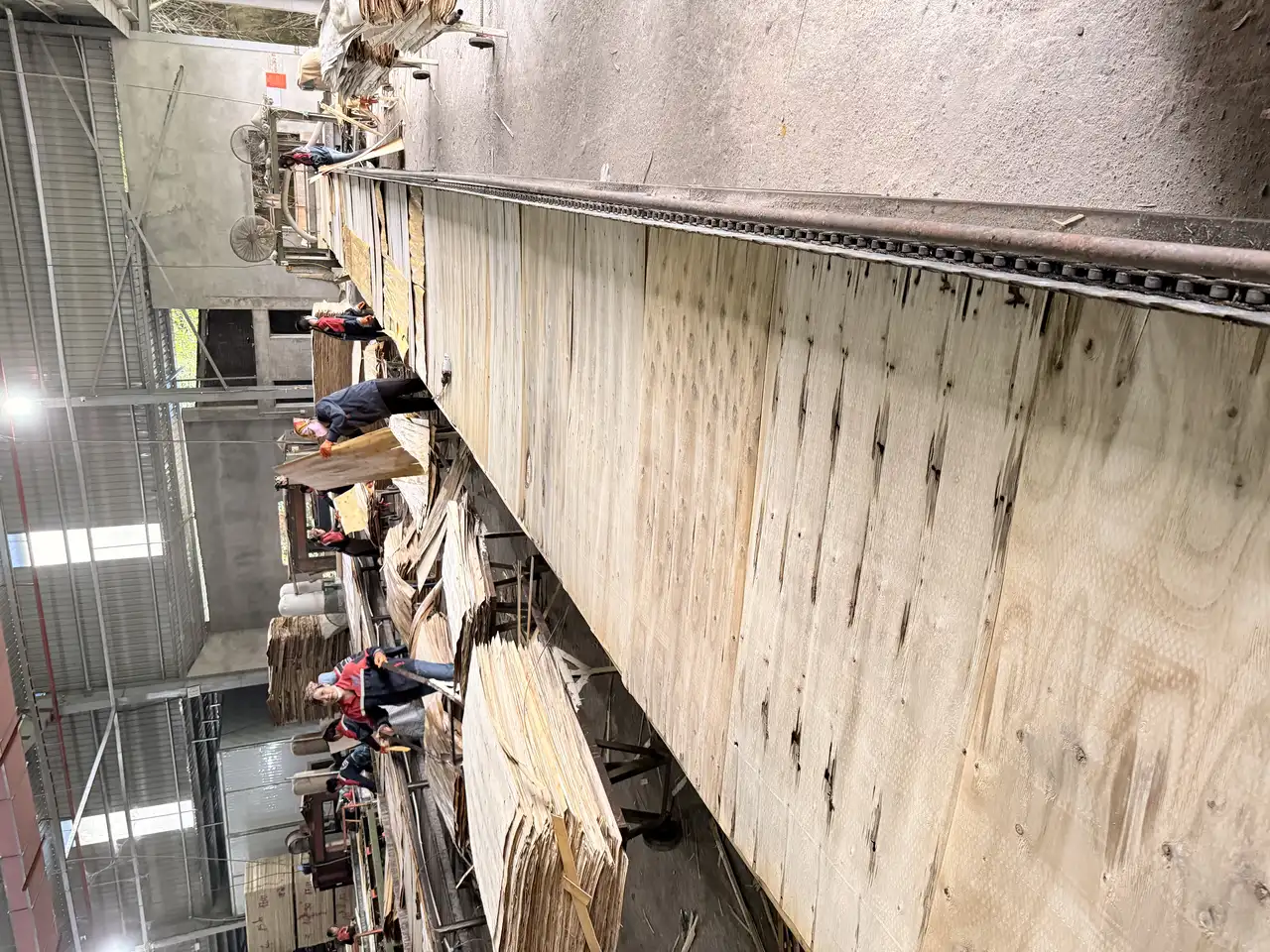 Vietnam plywood factory warehouse — stacked plywood sheets ready for export at HCPLY Phu Tho