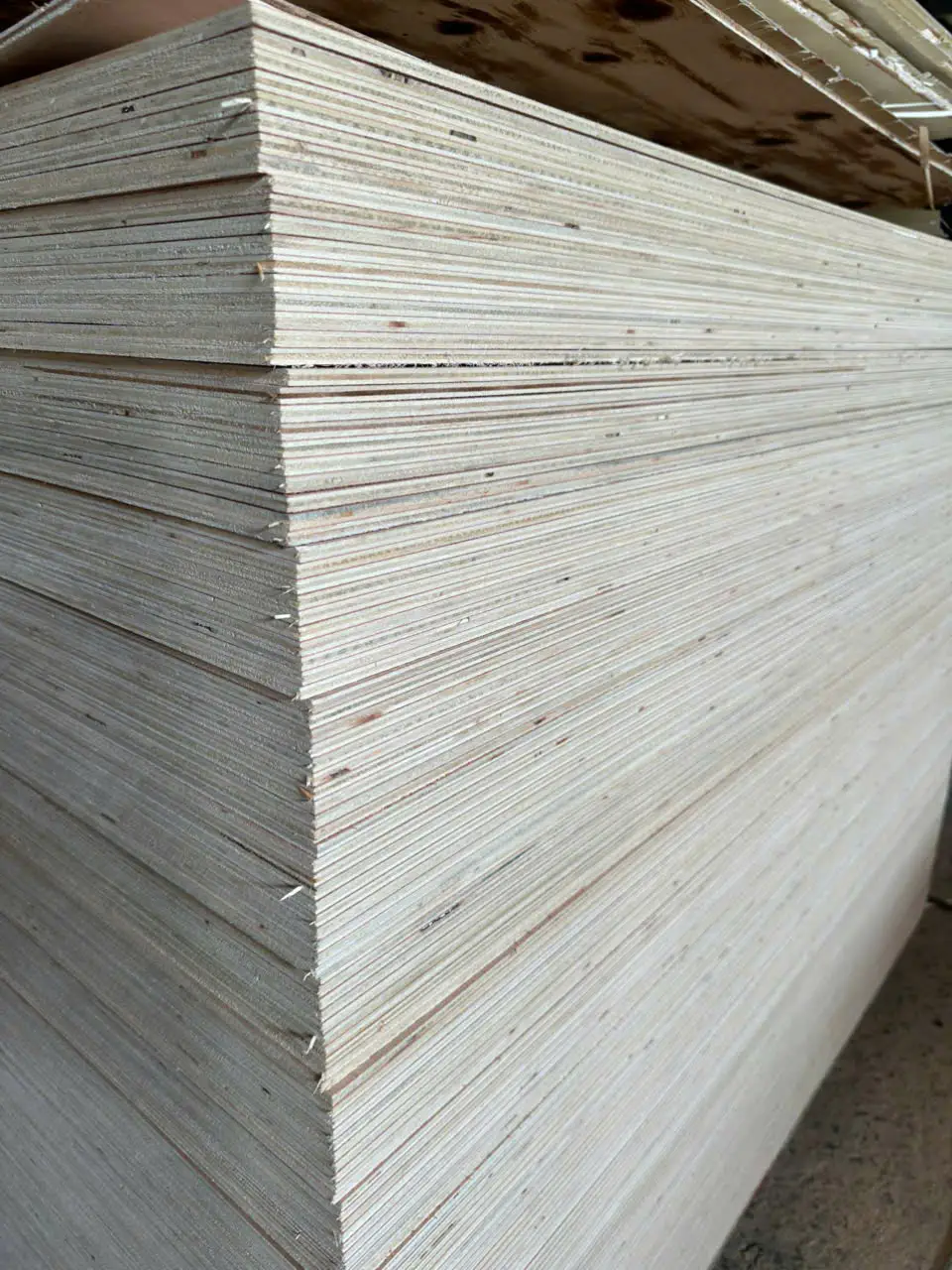 QC edge quality inspection of export-standard plywood at HCPLY Vietnam showing clean edge trimming
