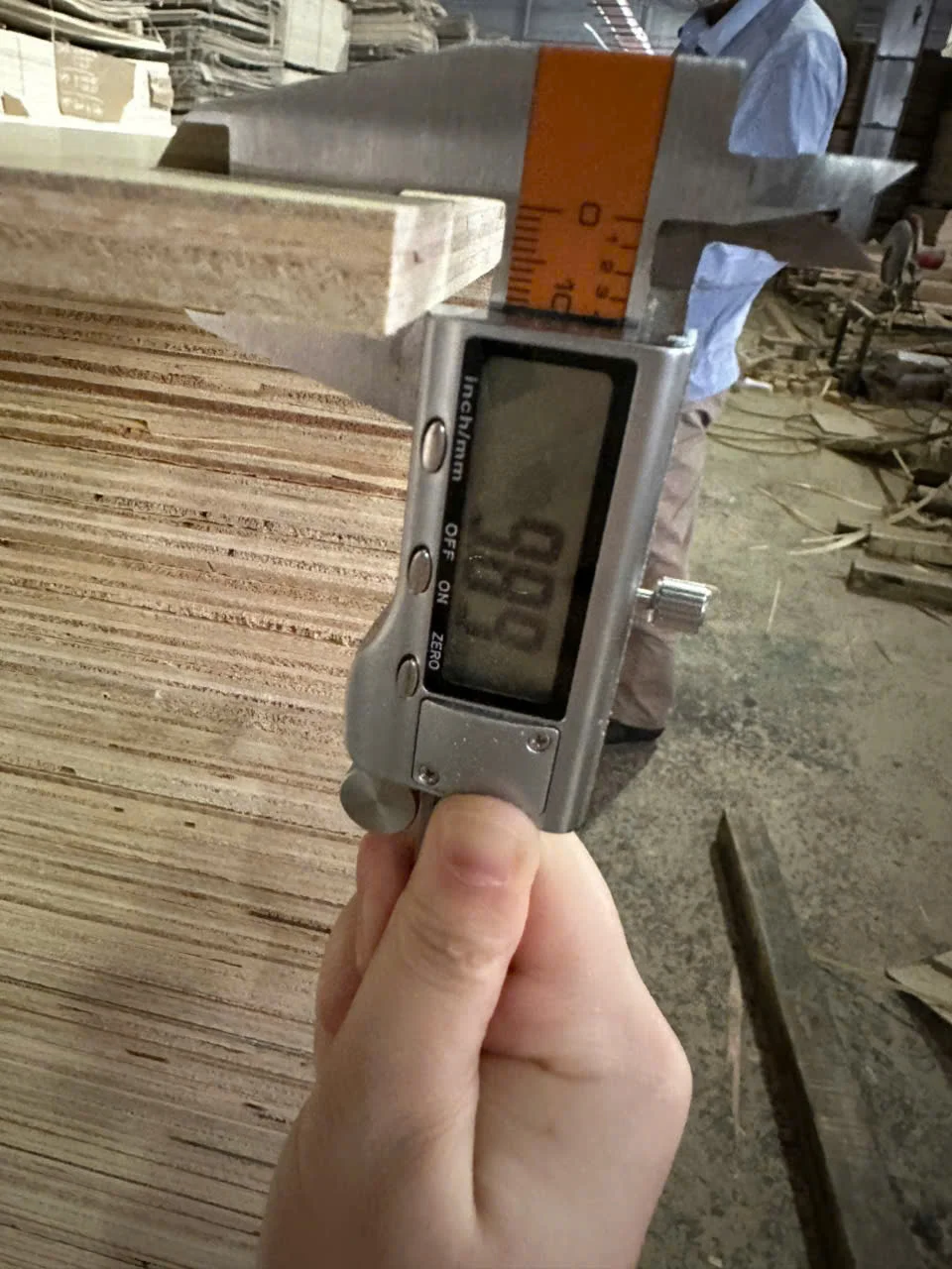 QC thickness measurement of 18mm plywood using digital caliper 5-point method at HCPLY Vietnam export factory
